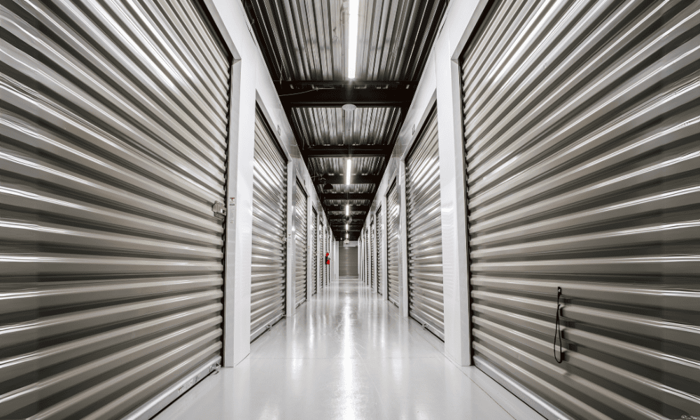 Well-lit hallway of climate-controlled self storage units at Storage Unit New Milford.